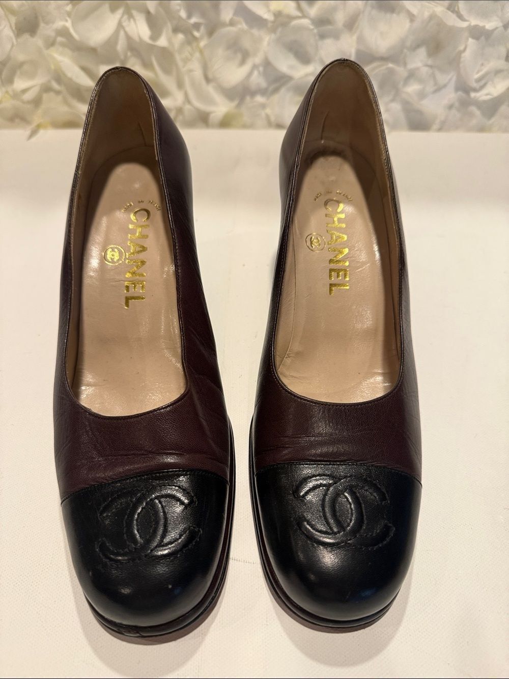 CHANEL Two-Tone Black and Burgundy Leather Cap-Toe Pumps